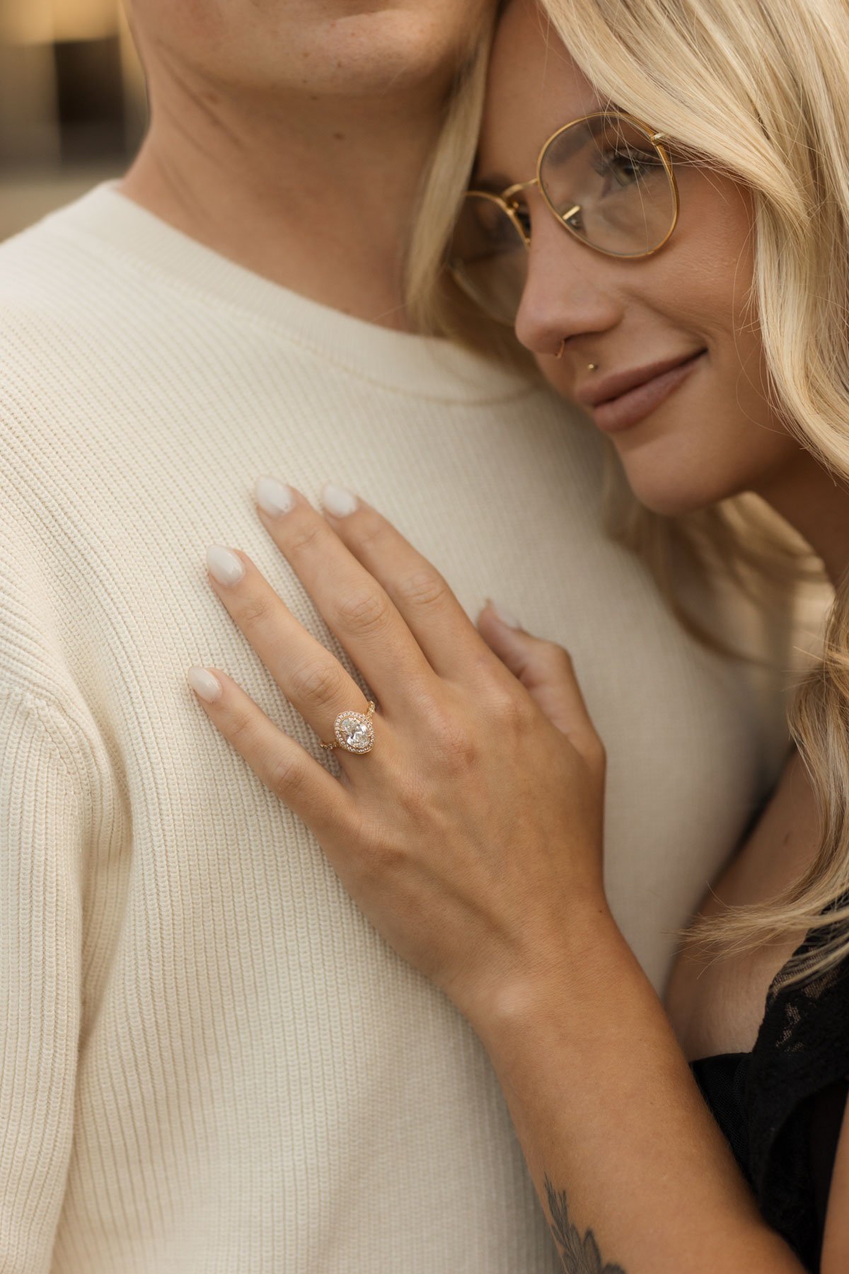 Close-up engagement portrait showing a woman’s ring during a couples photography session in Amsterdam